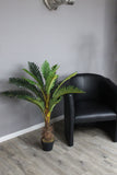 Künstliche Hawaii-Palme mit Naturstamm und 18 Palmenwedel. Textil. Pflegefrei. 100 cm Höhe.